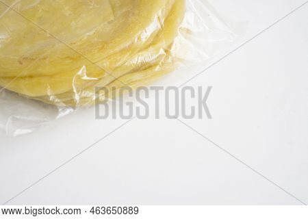 Homemade Frozen Food Maryam Bread Packaged In Plastic For Sale In The Market Isolated On White Backg