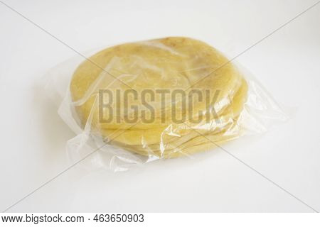 Homemade Frozen Food Maryam Bread Packaged In Plastic For Sale In The Market Isolated On White Backg