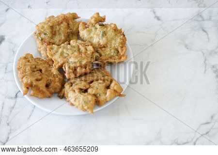 Bakwan Goreng, Fried Food, Indonesian Traditional Street Food Snacks. Fried Vegetables Dough Fritter