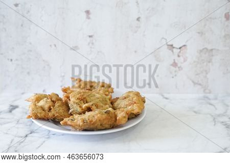 Bakwan Goreng, Fried Food, Indonesian Traditional Street Food Snacks. Fried Vegetables Dough Fritter
