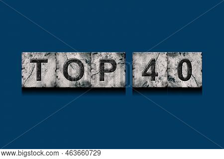 Top 40, Words, Above Different Numbers, On A Dark Blue Background. Alphabet On Stone Blocks.rating. 