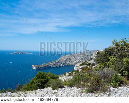 Calanques, France - May 20th 2020: Hiking High Above The Mediterranean Sea Along A Rocky Coast