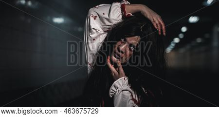 Horror Bloodthirsty Woman Ghost Or Zombie She Is Horror Scary With Breaks Her Neck At Dark Night, Sc