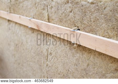 Mineral Grall Wool On The Wall With Wooden Plank. Warming House Before Winter Season