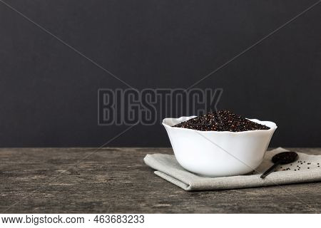 Quinoa Seeds In Bowl On Colored Background. Healthy Kinwa In Small Bowl. Healthy Superfood.