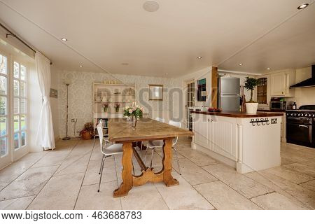 Stradishall, England - March 21 2016: Modern Open Plan Kitchen Dining Room With Traditional Decor An