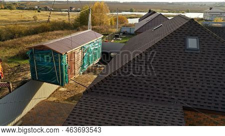 The Crane Sets The Bathhouse On The Territory. Delivery And Installation Of A Turnkey Bath. The Cran