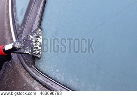 Cleaning Snow From Windshield, Scraping Ice, Winter Car Window Cleaning