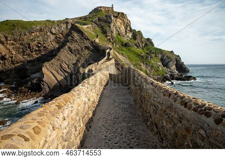 Stone Footpath To Famous Landmark And Film Location In North Of Spain, Ocean Islet With Chapel San J