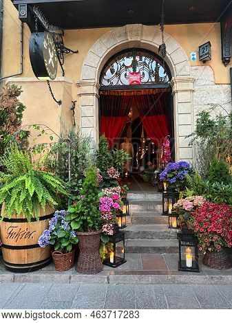 Warsaw, Poland - July 15, 2022: Beautiful Plants And Lanterns Near Entrance In Restaurant