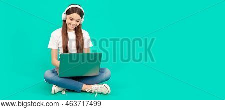 Happy Teen Girl Use Computer For Video Call Or Listen Webinar In Headphones, Online Education. Schoo