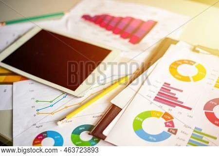 Business Financial Chart And Graphy Report  On Table With Digital Tablet