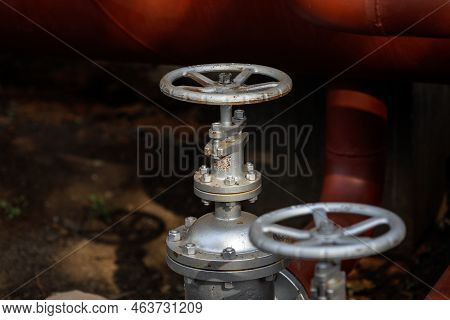 Shallow Depth Of Field (selective Focus) Details With Industrial Metallic Pipe Valves Used To Open O