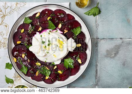 Beetroot Carpaccio With Mozzarella Burrata Cheesse And Pistachios