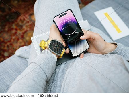 London, United Kingdom - Sep 28, 2022: Pov Woman Hand Holding The New Iphone 14 Pro Wearing New Appl