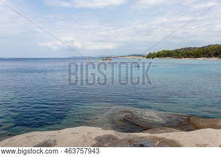 Beautiful Kalogria Beach And Moody Sky. Summer Vacation Travel Holiday Background Concept. Sithonia,