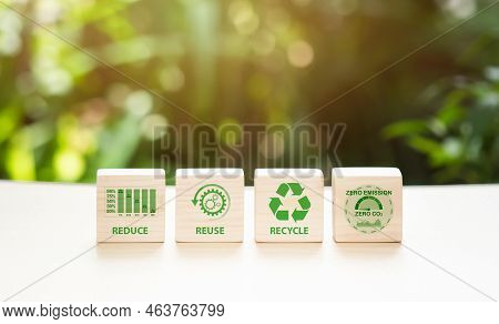 Concept Of Carbon Footprint And Reduced Carbon Emission. Carbon Footprint Symbols On A Wooden Cube W