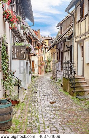 Eguisheim, France - October 4, 2021: Scenic Small Road With Half Timbered Houses In The Historic Vil