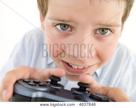 Young Boy Using Videogame Controller Smiling