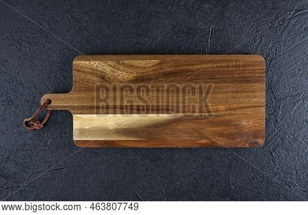 Wooden Cutting Board On A Black Wooden , Copy Spce