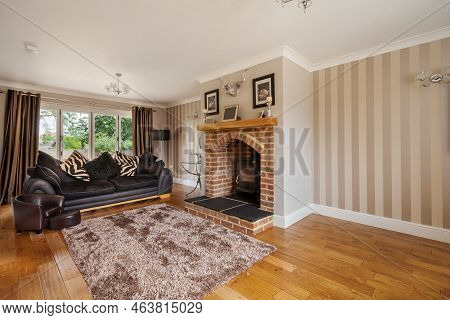 Duxford, Cambridgeshire, England - July 16 2015: Contemporary Modern Furnished Living Room With Timb