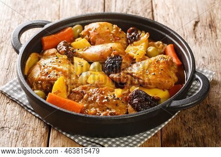 Salvadoran Chicken Stew With Chicha, Prunes, Carrots, Potatoes, Olives And Onions Close-up In A Fryi
