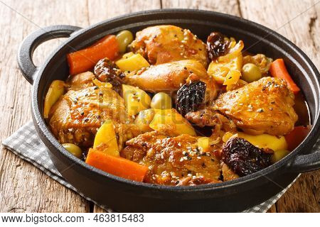 Gallo En Chicha Stew With Chicken, Prunes, Vegetables, And Spices Cooked To Have A Wonderful Flavor 