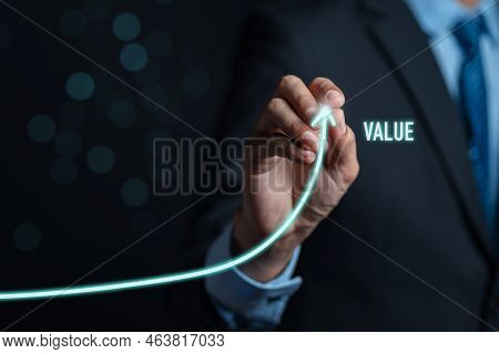 Businessman Writing Value Of Money Target Analyze Sales Data Trading And Showing A Growing Virtual S