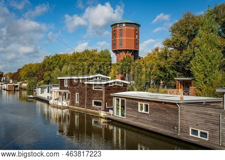 Scenery With Old Water Tower From 1892 Converted Into Apartment Complex Along The Canal With Housebo