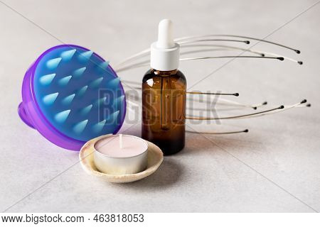 Manual Head Massagers Bottle Of Cosmetic Oil Candle On Gray Background Horizonta Spa Or Relax Concep