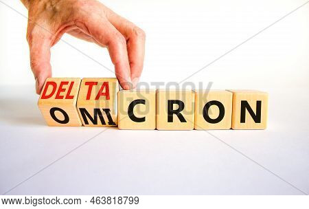 Covid-19 Omicron Or Deltacron Symbol. Doctor Turns Cubes And Changes The Word Omicron To Deltacron. 