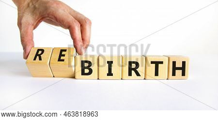 Birth Or Rebirth Symbol. Businessman Turns Wooden Cubes And Changes The Word Birth To Rebirth. Beaut