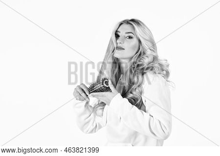 Woman Styling Her Hair With A Curling Iron. Hairstyle And Hairdressing. Girl Curling Long Hair With 