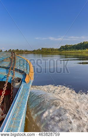Travel Destinations. The Pripyat River With Motorboat Passing Along The Shore.