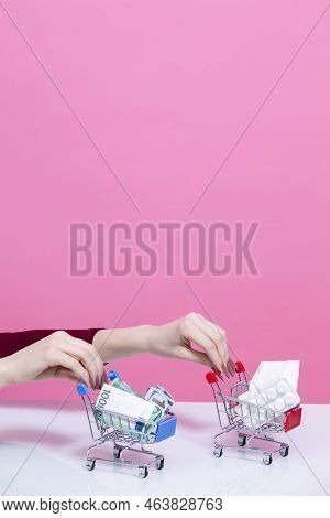 Purchasing Concepts. Female Woman Hand Holding Mockup Small Tiny Shopping Carts Trolley With Bunch O