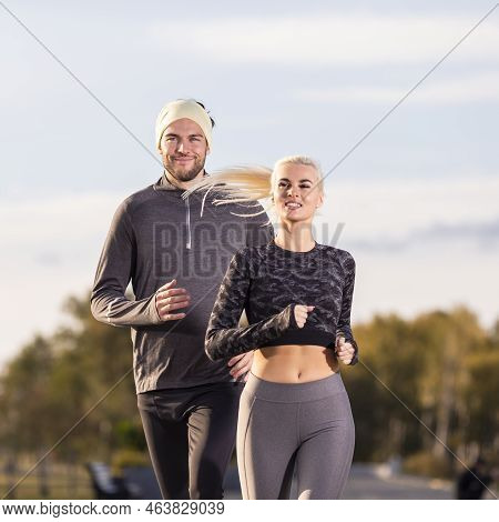 Two Positive Runners As Couple Training Together During Running Training Fitness Exercise At Nature