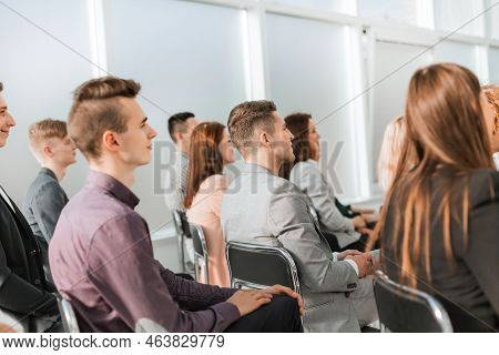Group Of Young Business People Sitting In The Conference Room