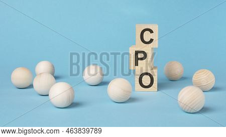 Text Cpo On A Wooden Cubes On A Blue Background