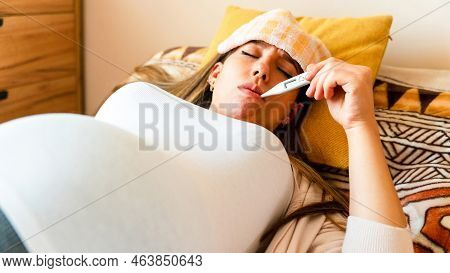Pregnant Thermometer Temperature Check. Pregnancy Woman Holding Thermometer, Check Fever Flu Tempera
