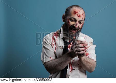 Horror Demon Looking At Cup Of Coffee, Wanting To Dirnk Beverage And Being Aggressive In Studio. Sca