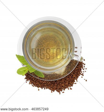 Cup Of Aromatic Buckwheat Tea, Granules And Mint On White Background, Top View
