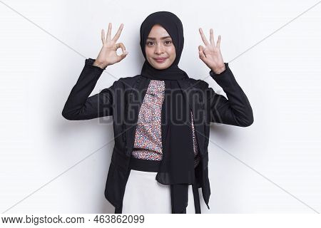 Young Asian Beautiful Muslim Business Woman With Ok Sign Gesture Tumb Up Isolated On White Backgroun