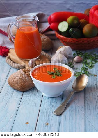 White Ceramic Bowl With Tomato Puree Soup, Rye Bun, Garlicky, Parsley And Vintage Spoon. Still Life 