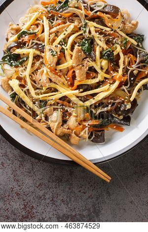 Japchae Korean Glass Noodle Stir Fry With Eggs, Vegetables And Mushrooms Closeup On The Plate On The
