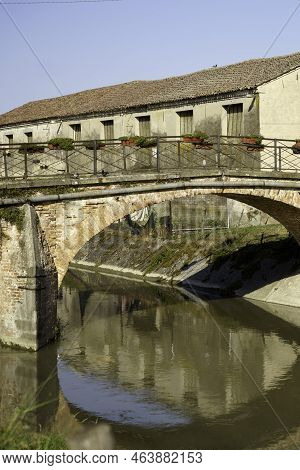 Old Buildings Along A Canal Near Badia Polesine, In Rovigo Province, Veneto, Italy