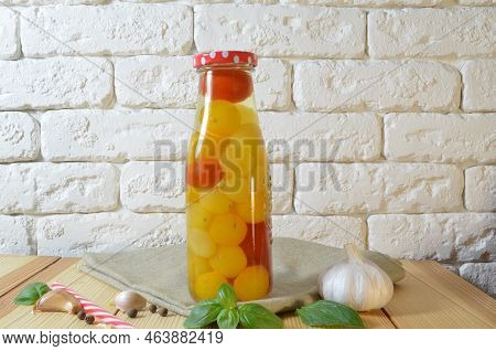 Tomatoes In A Jar. Red, Yellow Orange Fruits. Pickles. Proper Nutrition