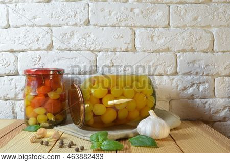 Tomatoes In A Jar. Red, Yellow Orange Fruits. Pickles. Proper Nutrition