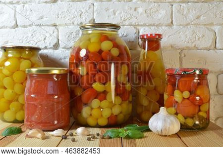 Tomatoes In A Jar. Red, Yellow Orange Fruits. Pickles. Proper Nutrition