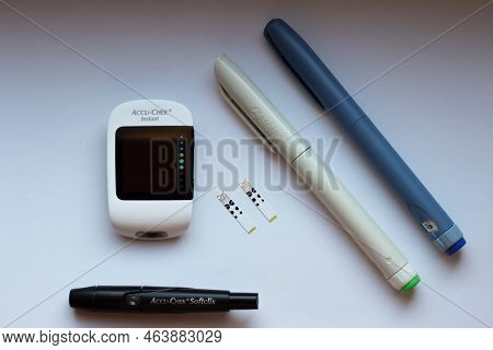 Poznan, Poland - 10.20.2022: Accu-chek Instant Glucose Meter With Toujeo Long Insulin And Apidra Sho