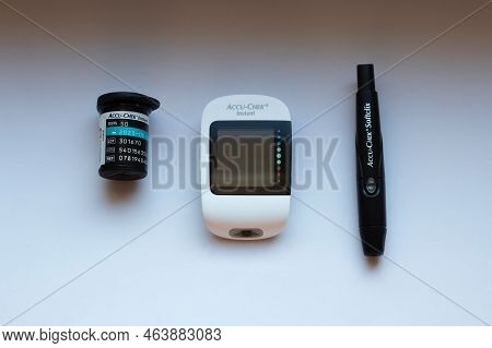 Poznan, Poland - 10.20.2022: Accu-chek Instant Glucose Meter With Test Strips And Finger Piercing De